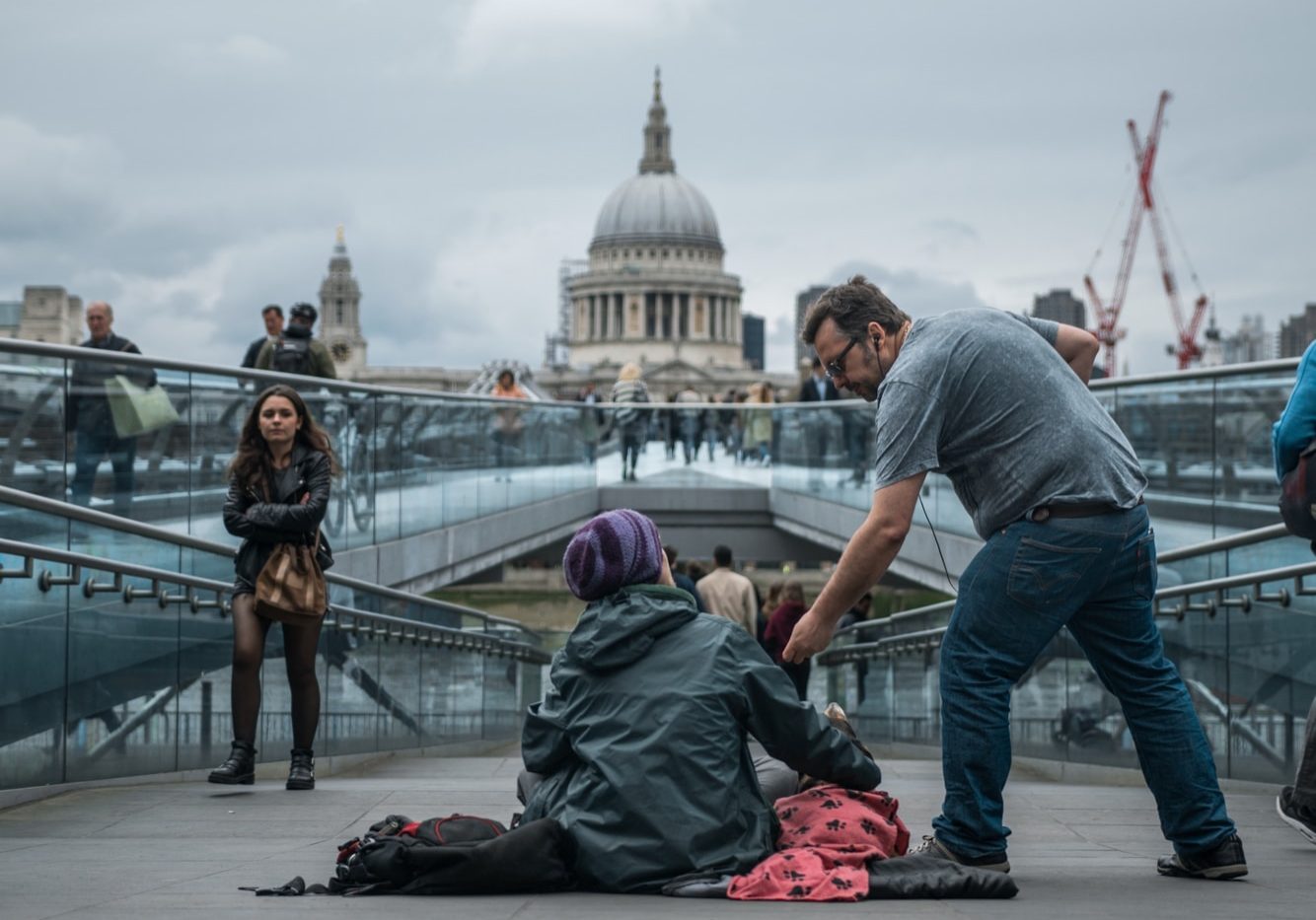 person sitting on floor near people